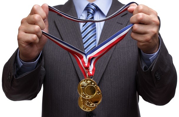 businessman with gold medals